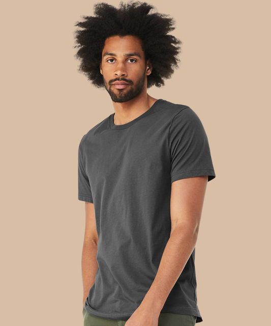 Man wearing a dark grey t-shirt against a beige background. Standard stock for Pathfinder Printworks hand printing services. Based in South Wales.