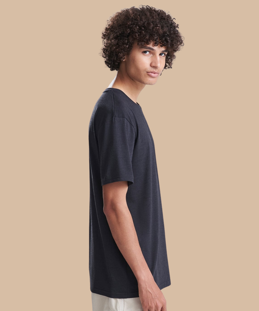 Side view of a man wearing a black t-shirt. Standard stock for Pathfinder Printworks hand printing services. Based in South Wales.