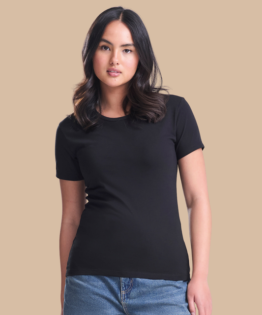 A woman modelling a black short-sleeve crewneck t-shirt against a solid beige background. Standard stock for Pathfinder Printworks hand printing services. Based in South Wales.