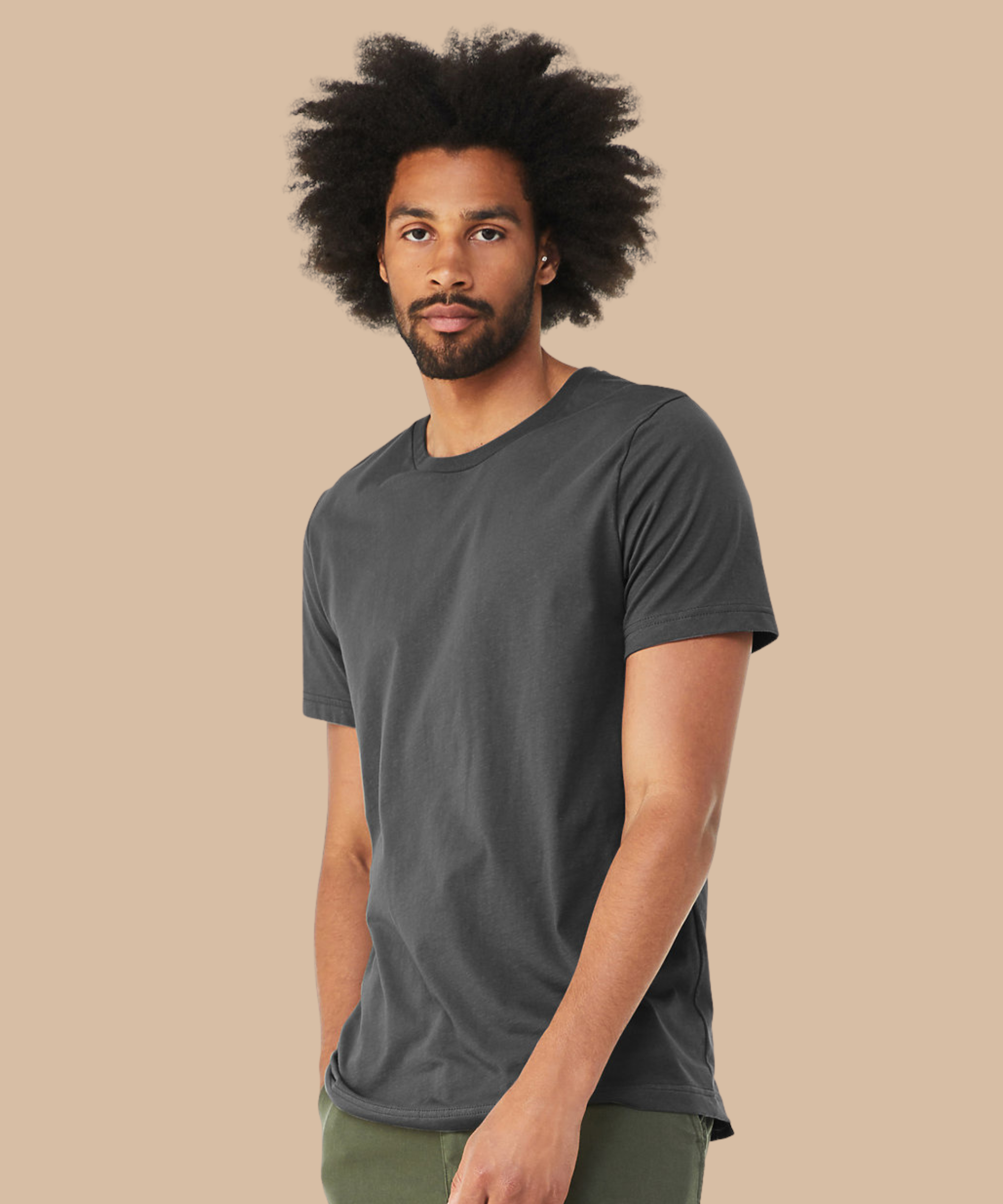 
Man wearing a dark grey t-shirt against a beige background. Standard stock for Pathfinder Printworks hand printing services. Based in South Wales.