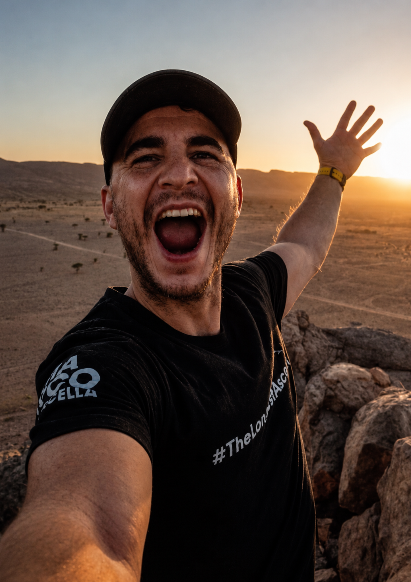 Man in a black t-shirt with #TheLongestAscent in white print across his front. Pathfinder Printworks hand screen print for clubs, gyms, businesses, and adventurers.