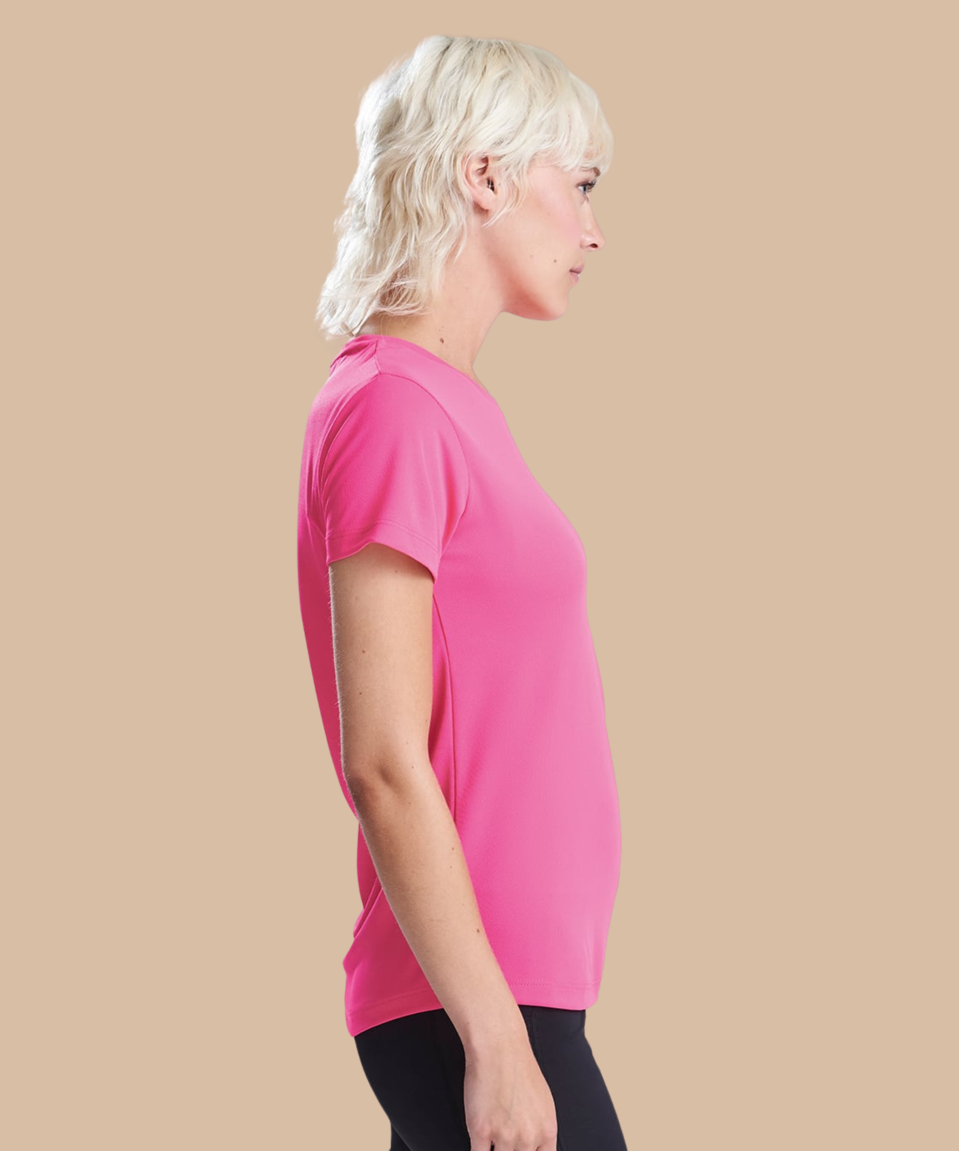 Woman wearing a pink t-shirt on a beige background. Standard stock for Pathfinder Printworks hand printing services. Based in South Wales.