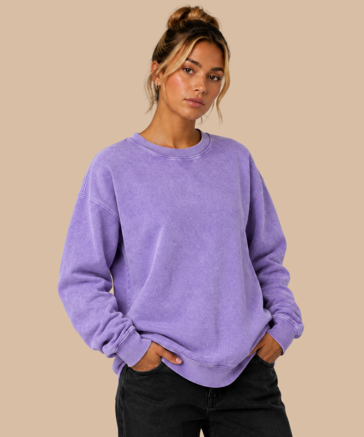 Woman wearing a lilac vintage washed sweatshirt with a relaxed fit, crew neck and ribbed cuffs and hem. Printing services from Pathfinder Printworks, based in South Wales.