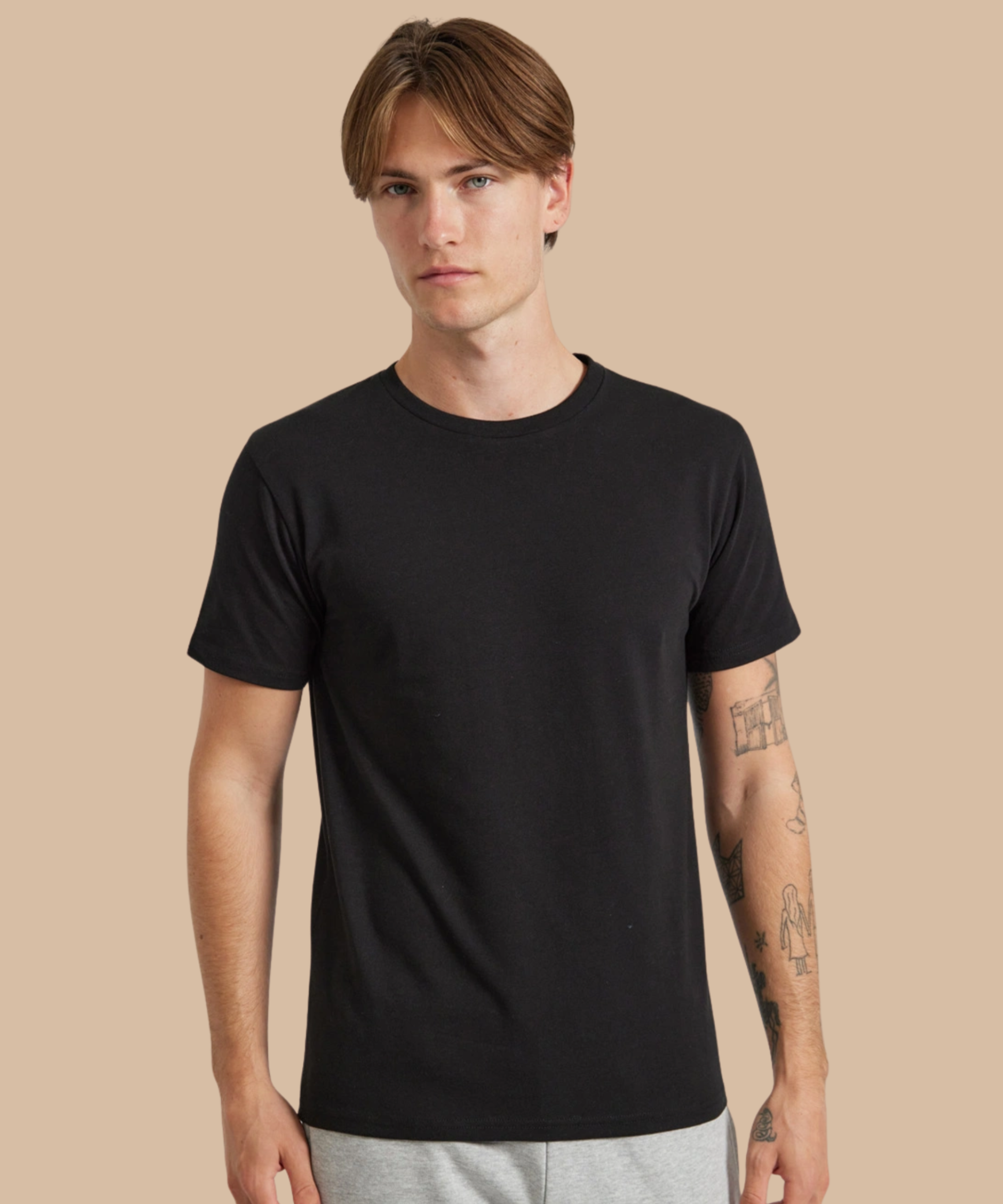 Man wearing a black soft stretch tri-blend t-shirt. Standard stock for Pathfinder Printworks hand printing services. Based in South Wales.