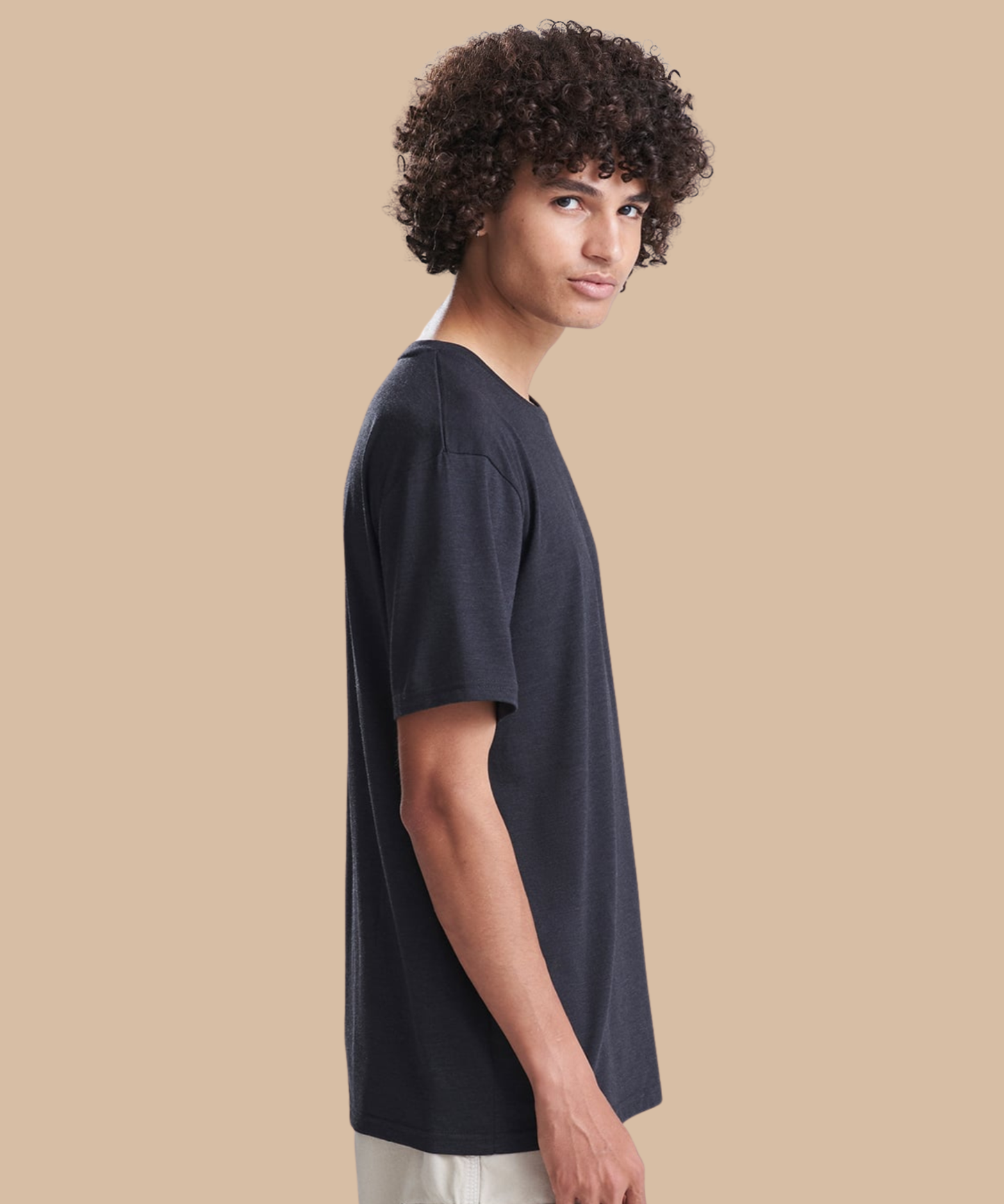Side view of a man wearing a black t-shirt. Standard stock for Pathfinder Printworks hand printing services. Based in South Wales.