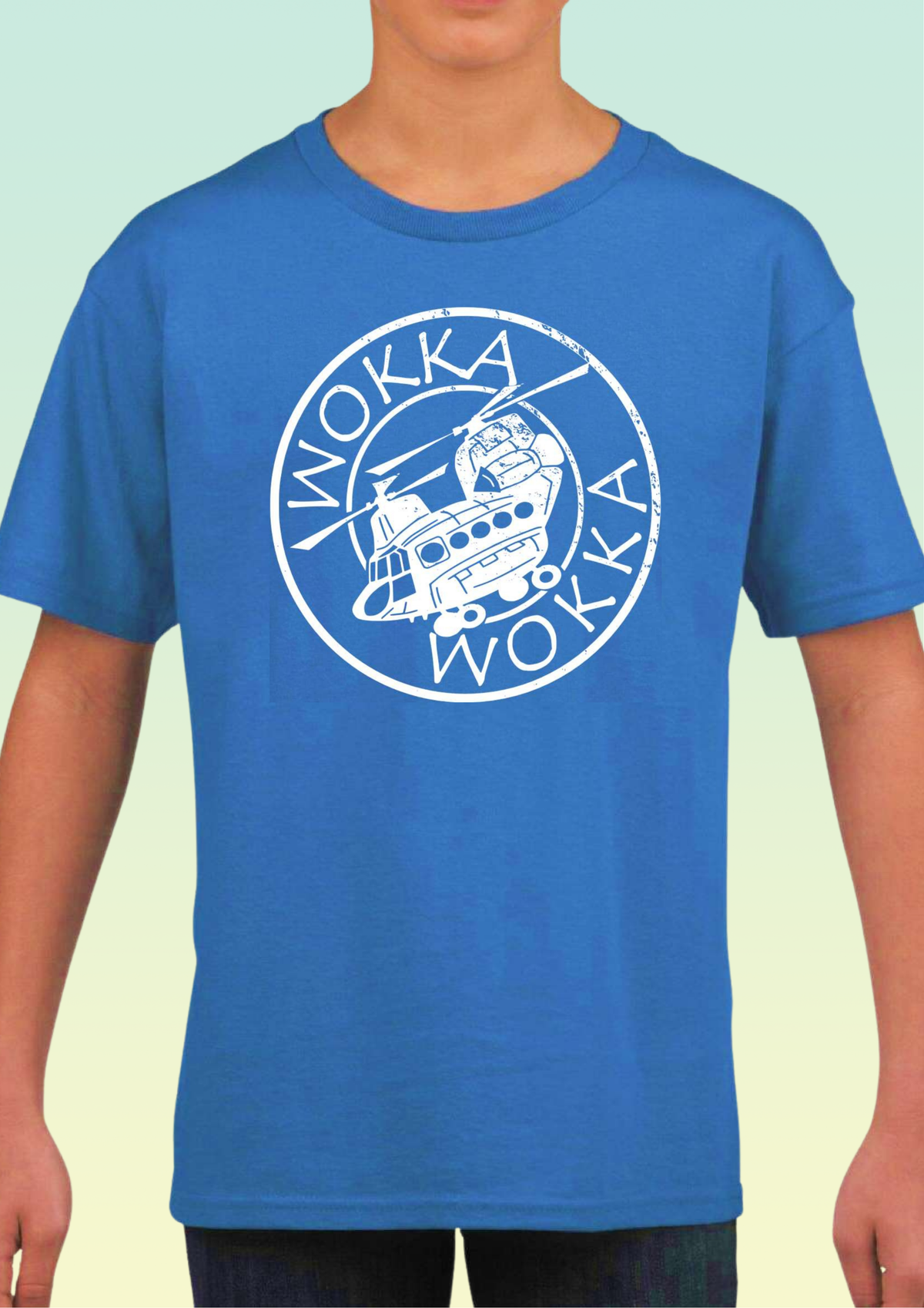 A person wearing a bright blue short-sleeve crewneck t-shirt with a large white circular graphic on the chest featuring the word 'WOKKA' and an  helicopter illustration. exclusive to Flying Teez.